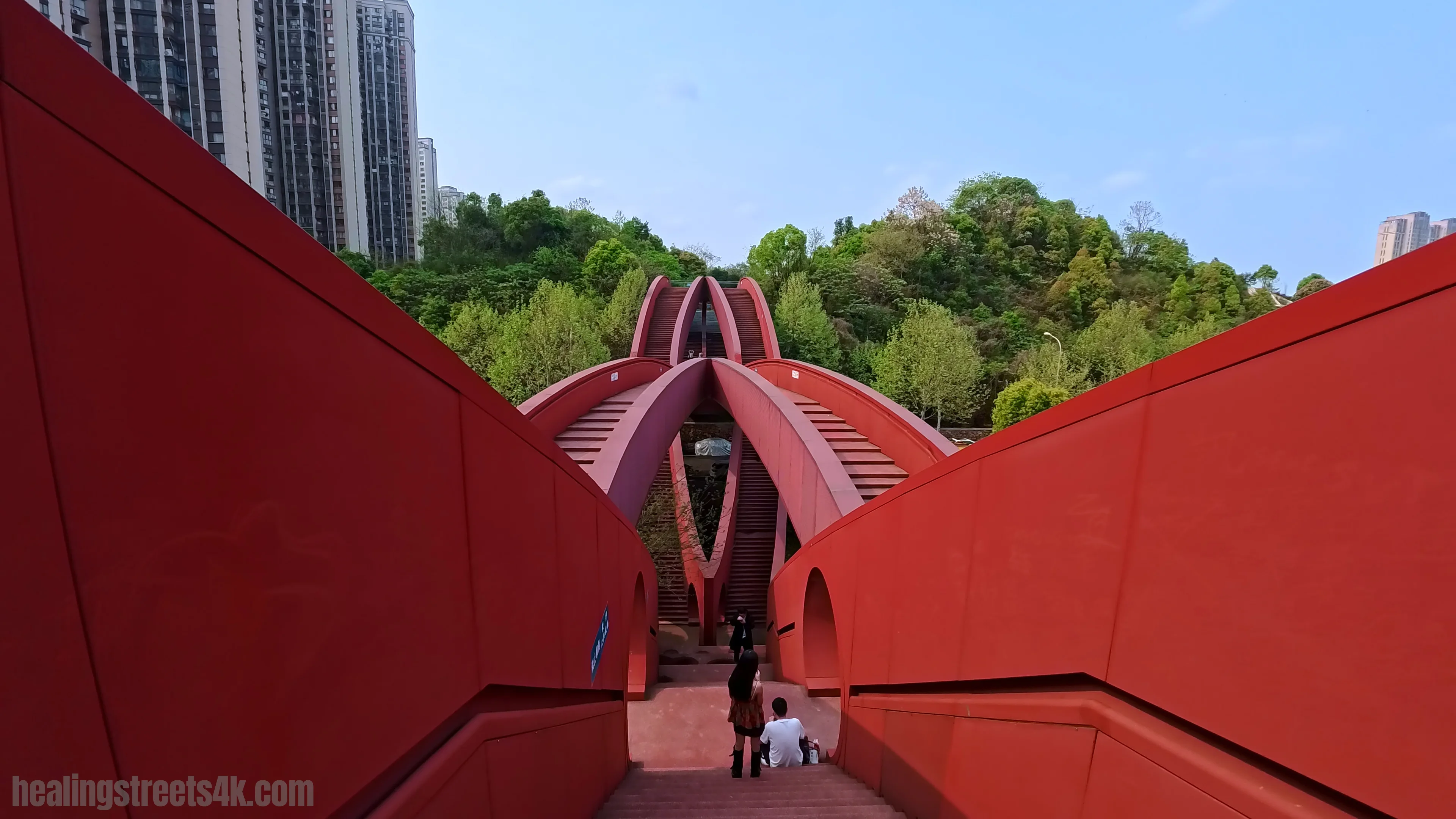 Pedestrian bridge crossing above the lakeside landscape