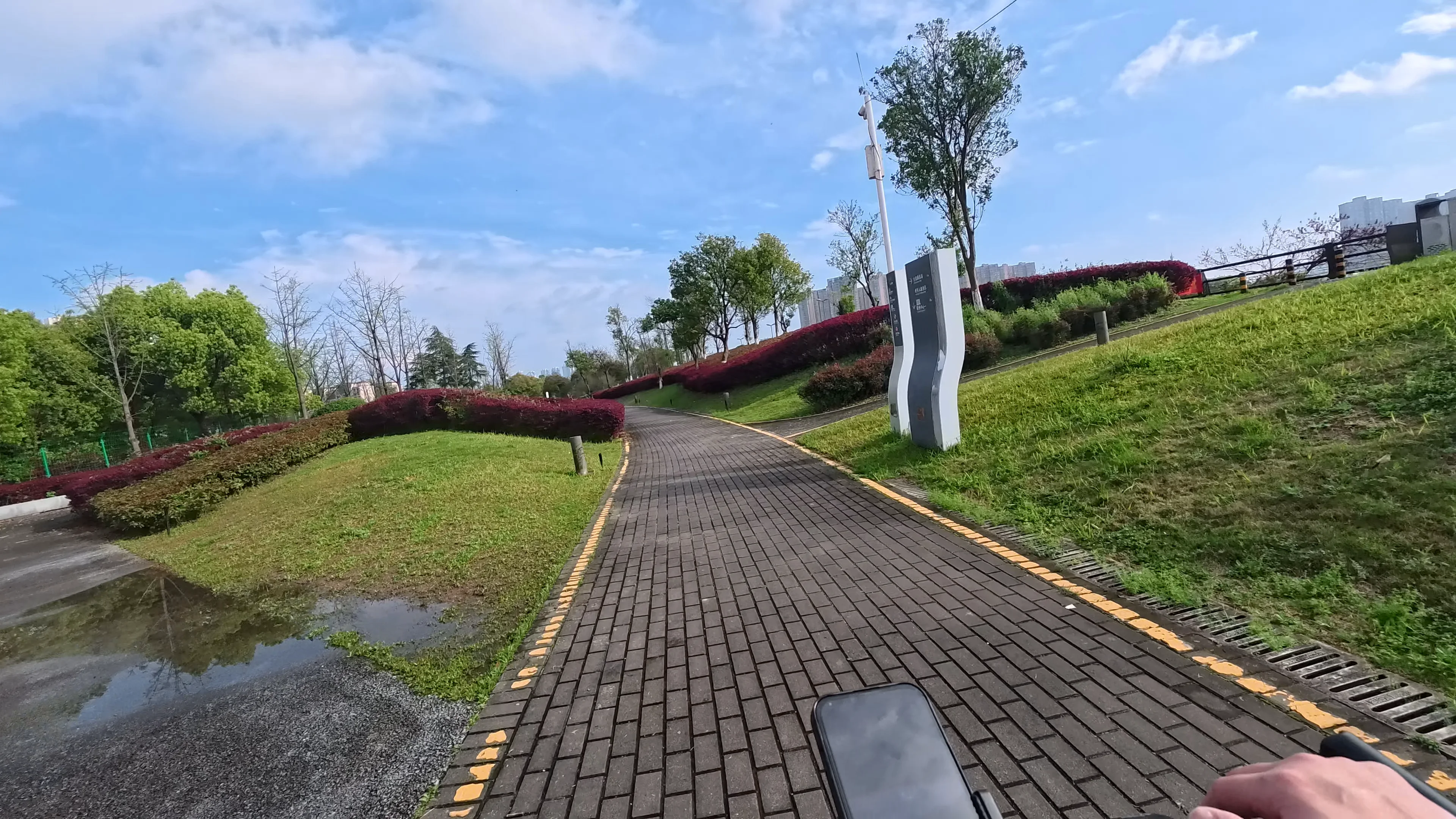 POV cycling along the peaceful riverside trail beside the Liuyang River in Changsha, China
